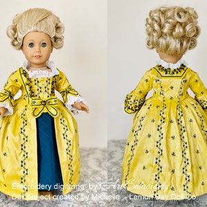 May include: A yellow doll dress with black embroidery and a blue underskirt. The dress has a fitted bodice and a full skirt. The doll is wearing a blonde wig with curls.
