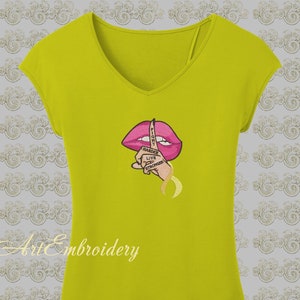 May include: Yellow t-shirt with a pink embroidered mouth with a finger over it. The finger has the text "FIGHT HARDER LIVE STRONGER" embroidered on it.