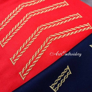May include: Two pieces of fabric, one red and one navy blue, with gold embroidery of a braided rope design. The text "Art Embroidery" is visible in the center of the image.