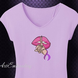 May include: Purple t-shirt with a pink lips design and a finger over the lips. The finger has the words "Fight Harder Live Stronger" written on it.