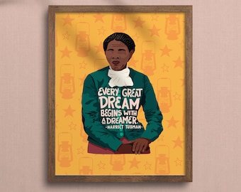 May include: A framed illustration of a woman with a green jacket and a white collar, standing against a yellow background with stars and lanterns. The quote "Every great dream begins with a dreamer. -Harriet Tubman" is written in white text.