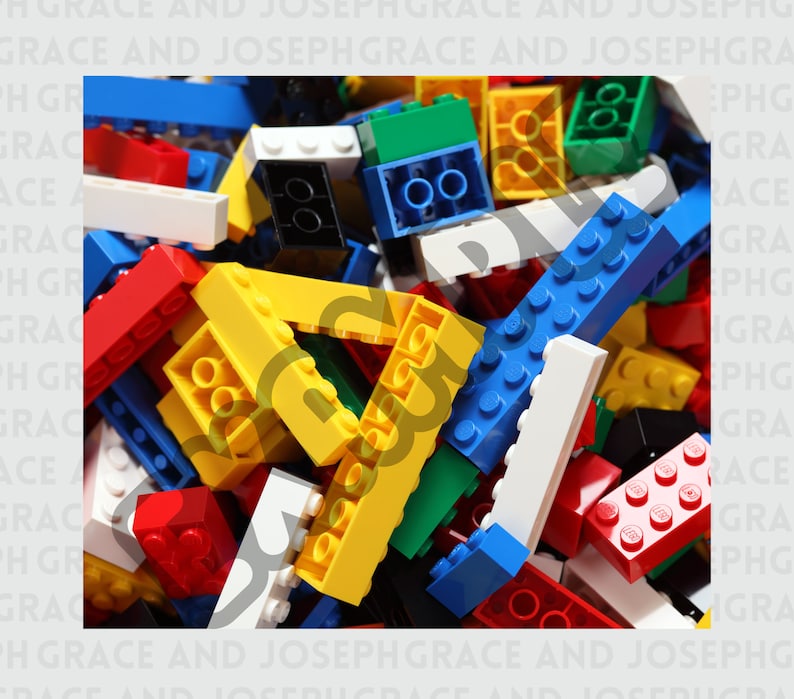 May include: A large pile of colorful plastic building blocks. The blocks are in various shapes and sizes, including squares, rectangles, and cylinders. The blocks are in shades of red, blue, green, yellow, and white.