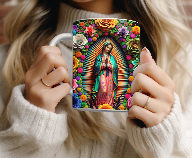 May include: White ceramic mug featuring a vibrant illustration of a religious figure surrounded by colorful flowers. The artwork includes a halo and a radiant background, with a variety of floral elements in shades of red, pink, orange, and purple.