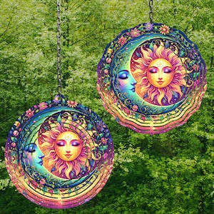 May include: A colorful metal wind chime featuring a sun and moon design with intricate details. The sun and moon have faces and are surrounded by flowers and vines. The wind chime is suspended from a chain.