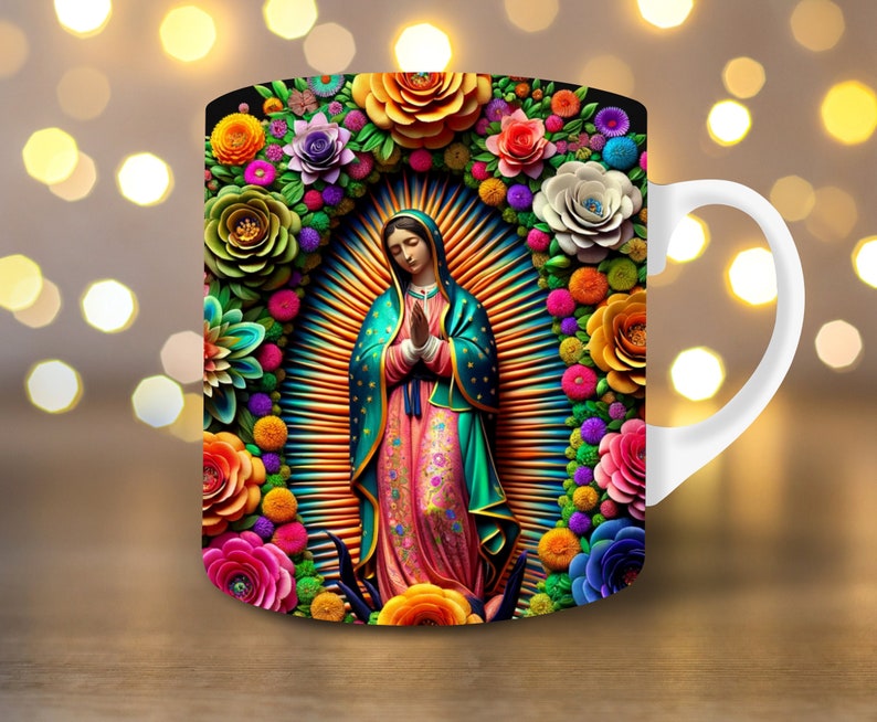 May include: White ceramic mug featuring a vibrant illustration of a religious figure surrounded by colorful flowers. The figure is depicted with hands clasped in prayer, wearing a teal and pink robe. The floral arrangement includes roses, daisies, and other blooms.