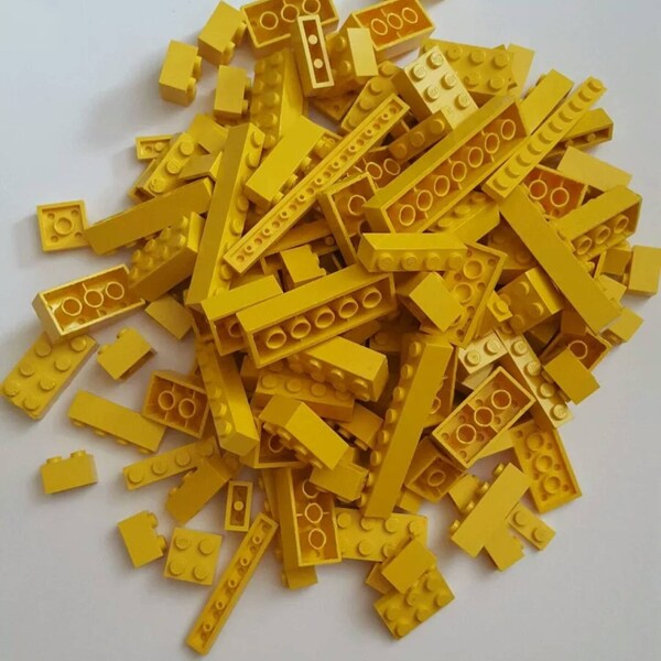 Lego half pound yellow mixed lot, various pieces.