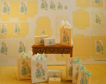 May include: A set of Peter Rabbit themed papercraft boxes and bags. The boxes and bags are decorated with Peter Rabbit illustrations and are perfect for gift giving or party favors. The boxes are in various sizes and shapes, and the bags are all the same size. The boxes and bags are all made of paper and are printed with a light blue and white checkered pattern.
