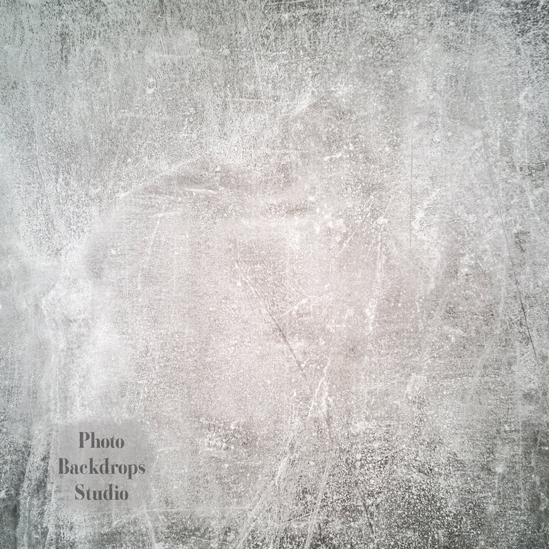 May include: A gray textured background with a subtle white pattern. The background is slightly darker in the center and lighter around the edges.