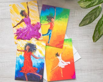 May include: Set of four greeting cards featuring colorful abstract paintings of women dancing. Each card has a different color scheme and background.