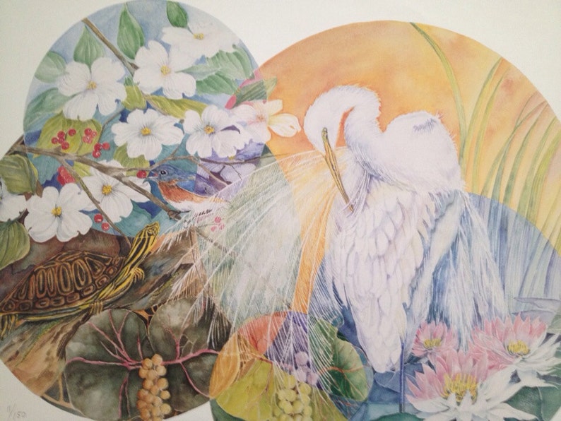 May include: Watercolor painting featuring a turtle, bluebird, and two white egrets. The artwork is set within overlapping circular frames, showcasing flora like white flowers, red berries, and pink water lilies. The background has a warm, orange glow.