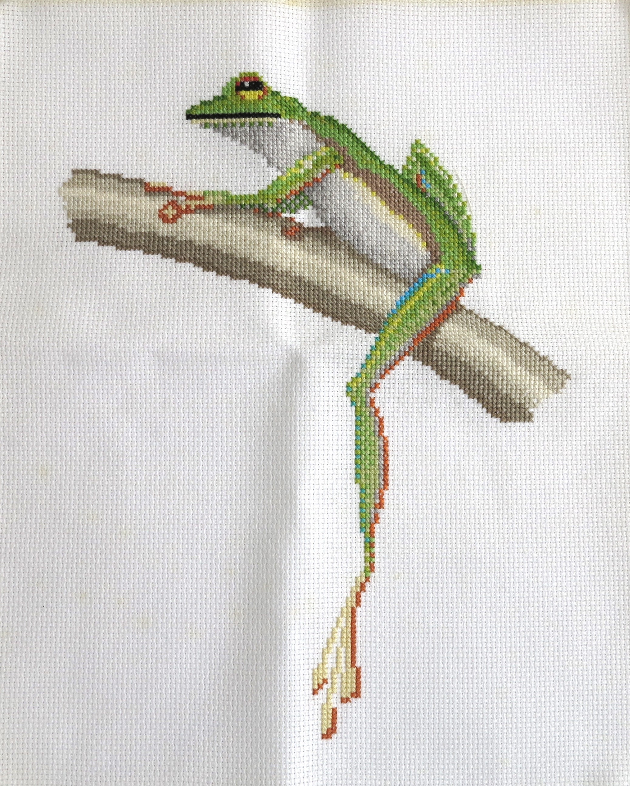 Download Embroidery of green frog sitting on a tree, continental ...