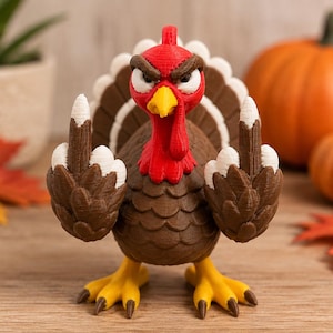 May include: A 3D printed turkey figurine with a red head, yellow beak, and brown body. The turkey has a stern facial expression with furrowed brows and is holding both wings up with the middle fingers extended in a rude gesture. The tail feathers are brown with white tips, and the feet are yellow.