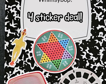 May include: A black and white composition notebook with a yellow border. The notebook has a sticker on the front that says "Whimsybop! 4 sticker deal!" There are four stickers on the notebook: a yellow rubber chicken, a red, green, blue, and orange star-shaped game board, a vintage television, and a black and white View-Master reel.