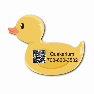 May include: A yellow rubber duck with a black and white QR code and the text "Quakarium 703-620-3532" printed on it.