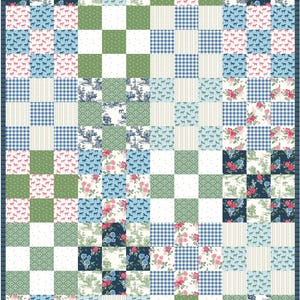 May include: A patchwork quilt featuring a variety of patterned squares. The quilt incorporates floral, horse, and gingham patterns in shades of blue, pink, green, and white. A dark blue border frames the design.