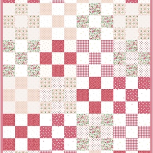 May include: A patchwork quilt with a pink border. The quilt features a checkerboard pattern of squares in various designs, including floral prints, polka dots, gingham, and solid pink and white squares.
