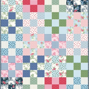 May include: A patchwork quilt featuring a variety of patterns and colors. The design includes squares of gingham, floral prints, horse silhouettes, and toile scenes in shades of blue, pink, red, and green. The quilt has a dark blue border.