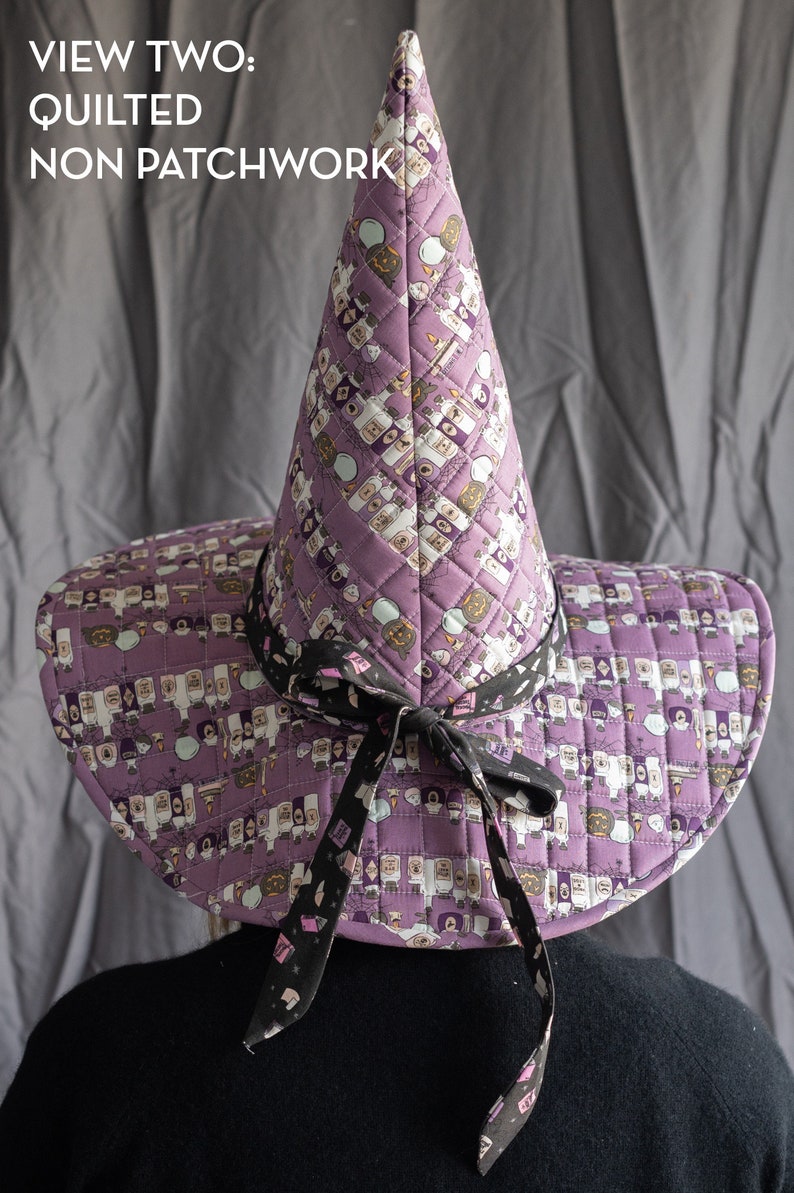 May include: A purple witch hat with a black ribbon and a print of potion bottles. The hat is quilted and has a pointed crown. The text "VIEW TWO: QUILTED NON PATCHWORK" is visible in the image.