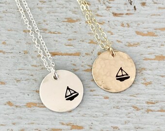 long necklace with steel chain and brass pendant in the shape of a sailboat handmade