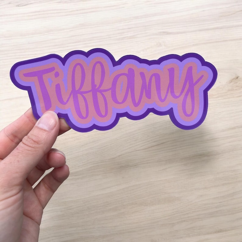 hand holding personalized sticker