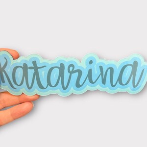 hand holding personalized sticker
