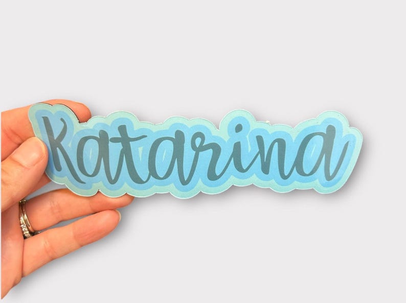 hand holding personalized sticker