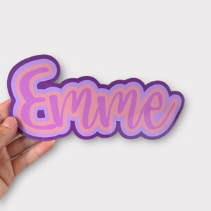 hand holding personalized sticker