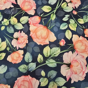May include: A seamless fabric pattern featuring pink and peach watercolor roses with green leaves on a dark blue background.