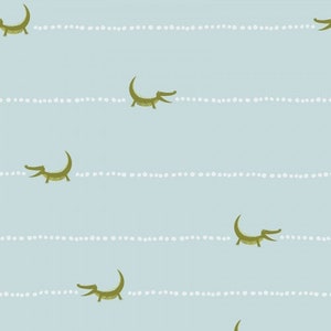 May include: A seamless pattern featuring green alligators swimming on a light blue background with white dotted lines.