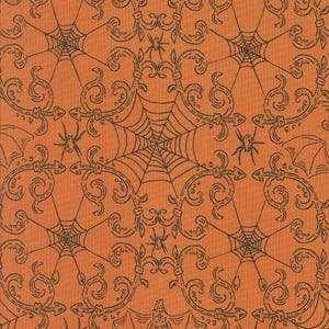 May include: Orange fabric with a repeating pattern of black spiderwebs, spiders, and ornate scrollwork. The design has a Halloween theme, with a vintage or antique aesthetic. The fabric is likely cotton or a similar material.