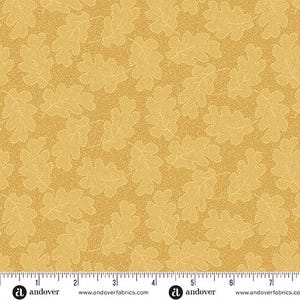 May include: Mustard-colored fabric with a repeating pattern of oak leaves. The leaves are a lighter shade of yellow and have a dotted texture. The fabric is suitable for quilting, sewing, and other craft projects.