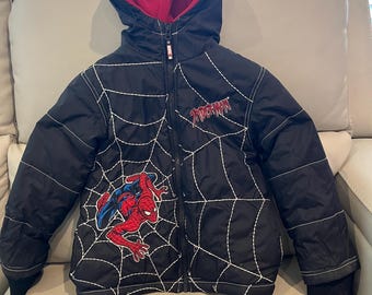 Boy’s size 5 Spider-Man fleece lined winter coat with thick webs stitched on front of coat and appliqué of Spider-Man on right side of coat.