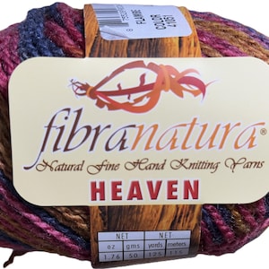 May include: A ball of yarn in a multi-colored pattern of brown, pink, and blue. The yarn is labeled "fibranatura" and "HEAVEN" with a net weight of 1.76 oz and 50 grams. The yarn is 125 yards or 115 meters.