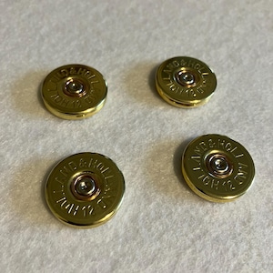 Marcadores de bolas de golfe Holland & Holland em formato de cartucho de espingarda (4 unidades). Marcadores de altíssima qualidade. Ideal para clubes de golfe e para presentear quem curte 4 bolas.