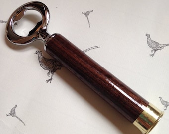 Holland & Holland Shotgun Shell solid walnut bottle opener.