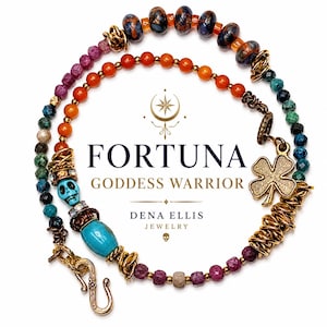 May include: A beaded necklace featuring a turquoise skull bead, a four-leaf clover charm, and various colorful gemstone beads in orange, blue, and purple. The necklace includes gold-toned metal accents and a hook clasp. Text reads FORTUNA GODDESS WARRIOR DENA ELLIS JEWELRY.