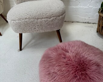 Pink fuzzy ottoman deals