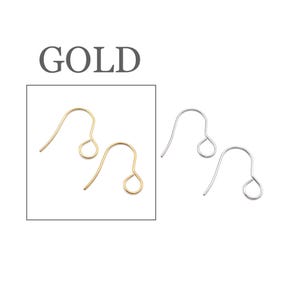 Peut inclure: Deux crochets de boucle d'oreille en m&eacute;tal dor&eacute; avec un design en fil courb&eacute; et une boucle circulaire &agrave; la base, plac&eacute;s dans un cadre carr&eacute;, avec le mot GOLD imprim&eacute; au-dessus. &Agrave; droite se trouvent deux crochets en m&eacute;tal argent&eacute; identiques.