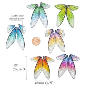May include: Set of six pairs of iridescent dragonfly wings with a gradient of colors. Each pair of wings is approximately 2-1/8 inches tall and 5/8 inches wide. The wings have a 1.5mm hole on each piece.