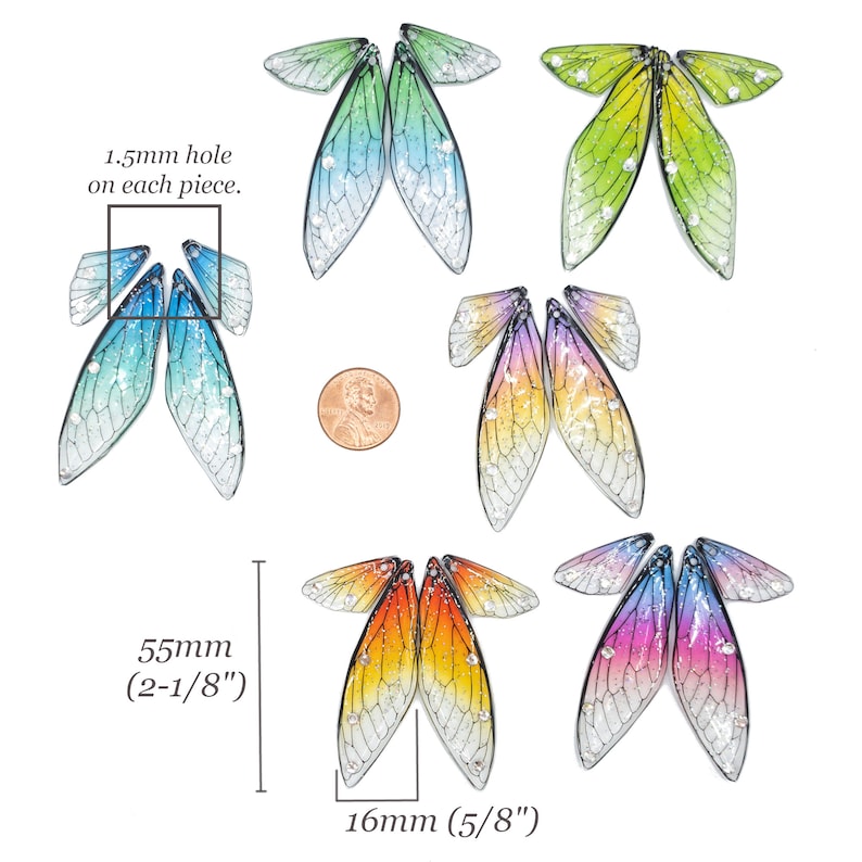 May include: Set of six pairs of iridescent dragonfly wings with a gradient of colors. Each pair of wings is approximately 2-1/8 inches tall and 5/8 inches wide. The wings have a 1.5mm hole on each piece.