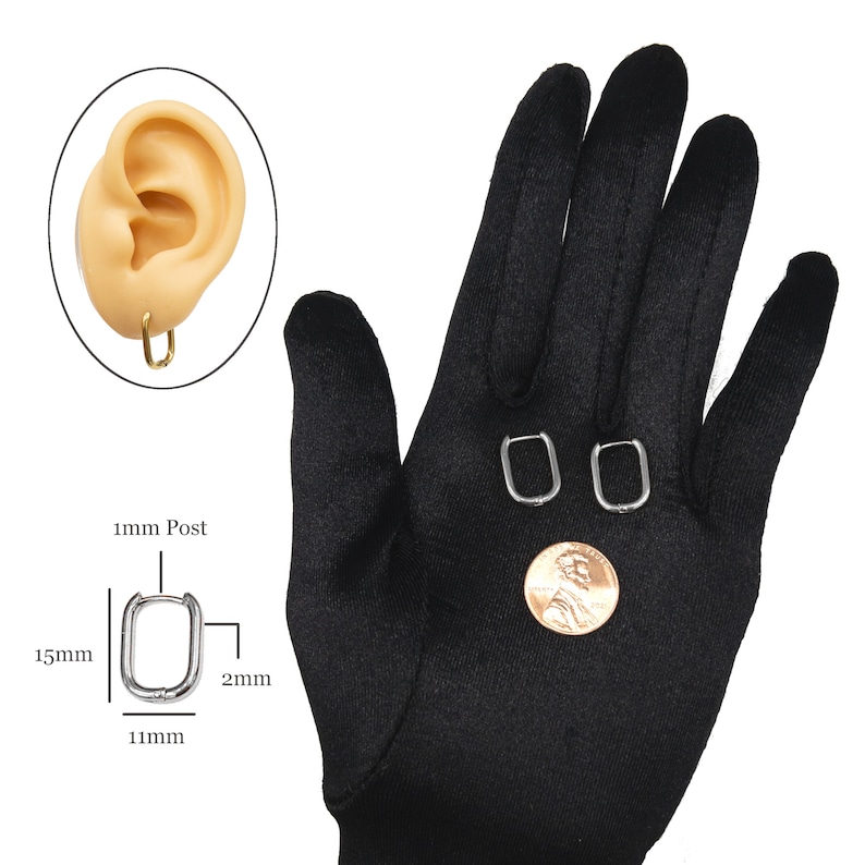 May include: A pair of silver hoop earrings with a rectangular shape. The earrings are 11mm wide, 15mm long, and 2mm thick. The post is 1mm thick. The earrings are shown on a black surface.