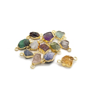 May include: Assortment of colorful gemstone connector charms with gold-plated accents. Each charm features a unique, irregular shape and is perfect for jewelry making.