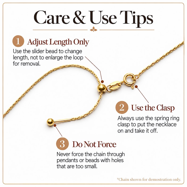 May include: A gold-toned chain necklace with a slider bead mechanism and a spring ring clasp. The image includes text titled Care & Use Tips, instructing to adjust length only with the slider, use the clasp for removal, and avoid forcing the chain.
