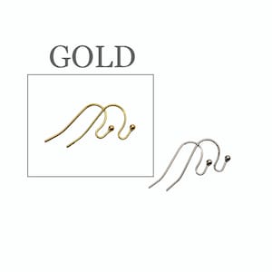 May include: A pair of gold-toned metal earring hooks with a small ball accent at the end, displayed within a box labeled GOLD. Beside the box is a pair of silver-toned metal earring hooks with a matching small ball accent at the end.