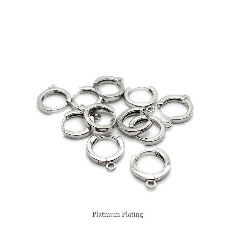 May include: A collection of small, circular, silver-toned metal hoop earrings with hinged closures and attached loops for charms. Each piece features a smooth, reflective surface with a platinum plating finish as indicated by the text Platinum Plating.