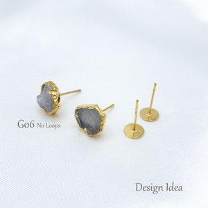 May include: Two stud earrings featuring irregular, grey, raw-cut stones encased in gold-toned metal settings, accompanied by two plain gold-toned flat-pad earring posts. The text G06 No Loops and Design Idea is visible on the image.