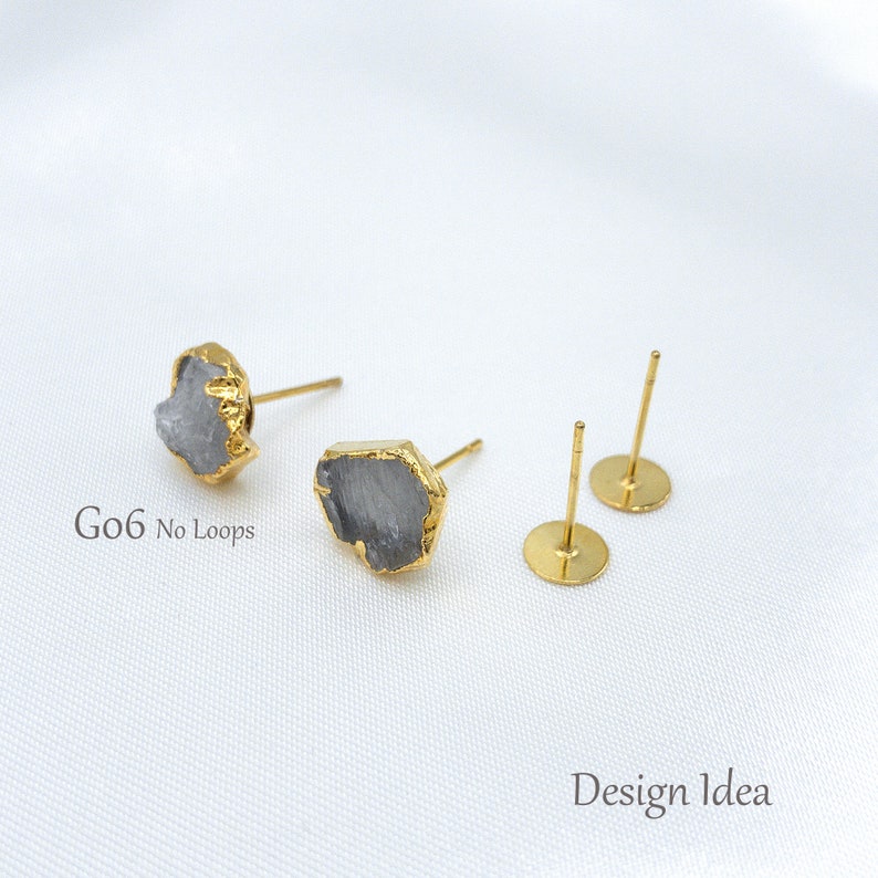 May include: Two stud earrings featuring irregular, grey, raw-cut stones encased in gold-toned metal settings, accompanied by two plain gold-toned flat-pad earring posts. The text G06 No Loops and Design Idea is visible on the image.