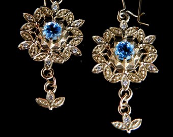 Blue Topaz and diamond 14 k gold Snowflake earrings