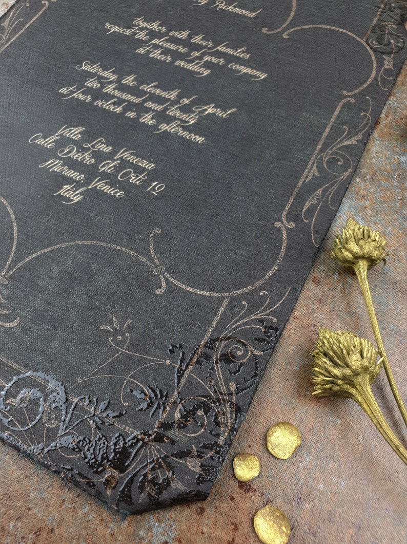 May include: Black wedding invitation with gold lettering. The invitation is for a wedding on Saturday, April 11, 2020, at 4:00 PM. The wedding will be held at Villa Lina Venezia, Calle Dietro Gli Orti 12, Murano, Venice, Italy.