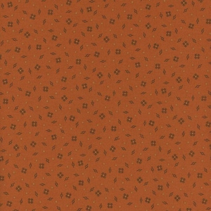 May include: A seamless pattern featuring a warm orange-brown background with a repeating design of small, dark brown hash marks, diamonds, and dots. The pattern has a subtle, textured appearance.